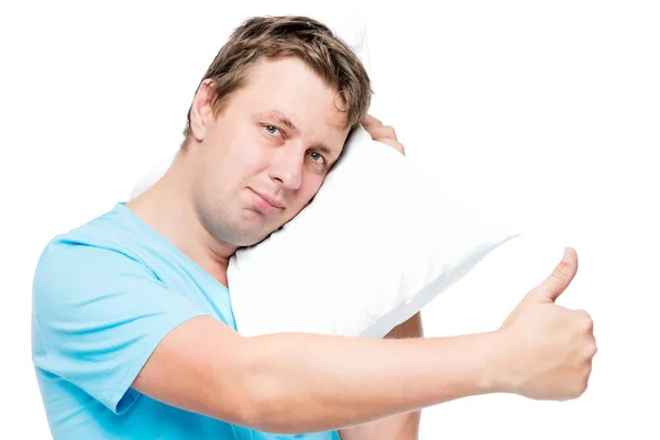 Joven feliz con almohada sobre fondo blanco — Foto de Stock