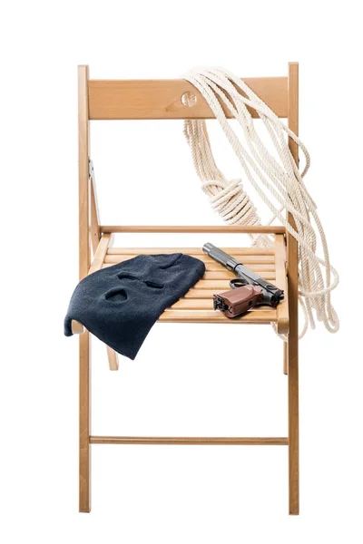Dřevěná židle s objekty pro rukojmí na bílém pozadí je — Stock fotografie