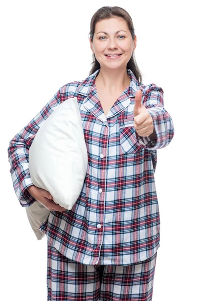 Mujer joven satisfecha en pijama con almohada posando sobre una espalda blanca — Foto de Stock