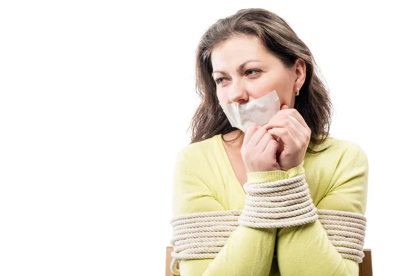 Close-up portrait of a hostage bound with a sealed mouth — Stock Photo, Image