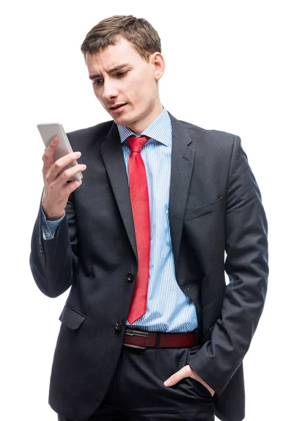 Empresario emocional con teléfono en la mano sobre fondo blanco — Foto de Stock