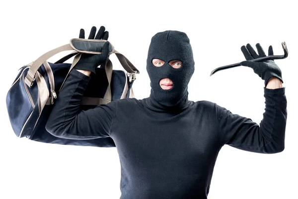 Robber with a bag and a crowbar raised his hands up to the polic — Stock Photo, Image