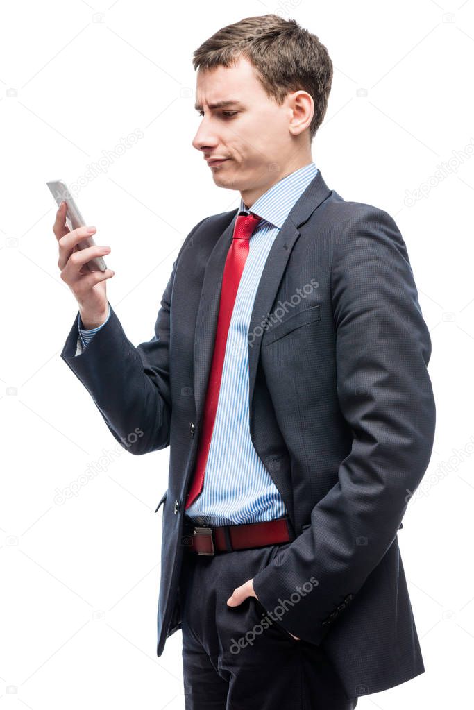 Pensive boss with phone in hand on white background