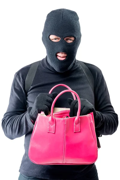 Strafrecht met een roze zak op zoek naar waardevolle dingen op een wit — Stockfoto