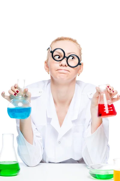 Tired crazy chemist in glasses with test tubes conducting experi — Stock Photo, Image