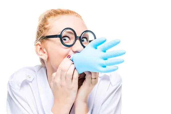 Crazy doctor blows a blue glove, portrait is isolated — Stock Photo, Image