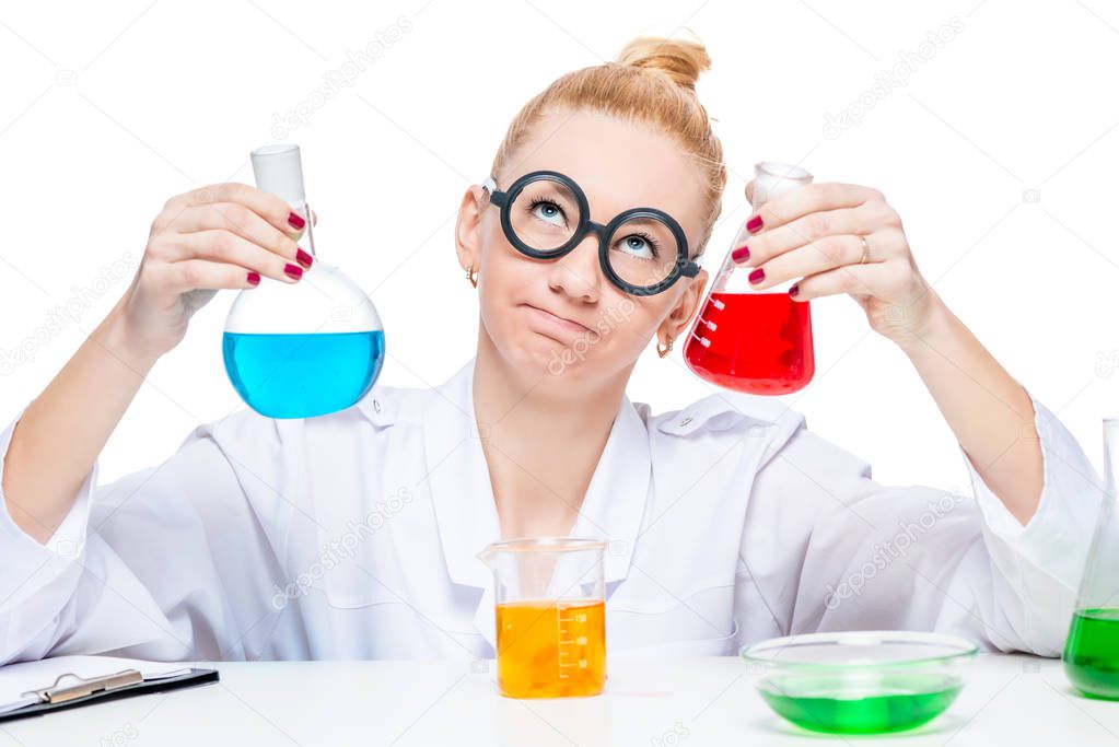 Beautiful crazy biologist chemist with test tubes thinks about t