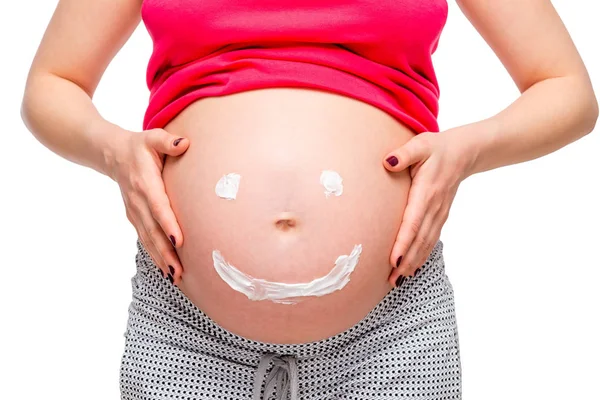 Glimlach op de buik van zwangere vrouw, foto dicht omhoog geïsoleerd — Stockfoto