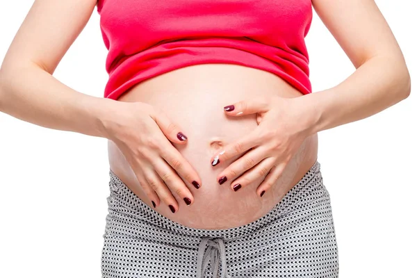 Primer plano de la crema para frotar las manos en la piel abdominal —  Fotos de Stock