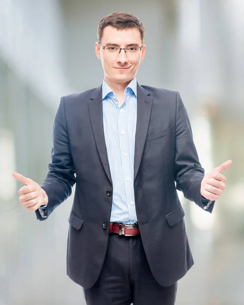 Successful businessman in a shirt extends a hand for greetings in office — Stock Photo, Image