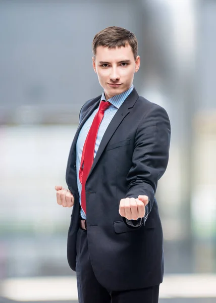 Successful businessman in a shirt extends a hand for greetings in office — Stock Photo, Image