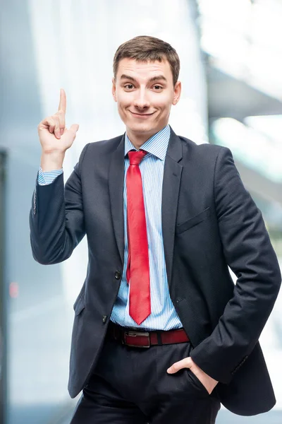 Successful businessman in a shirt extends a hand for greetings in office — Stock Photo, Image