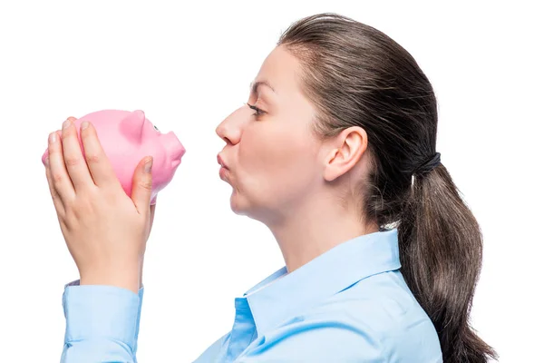 Girl with a favorite pink piggy bank isolated portrait — Stock Photo, Image