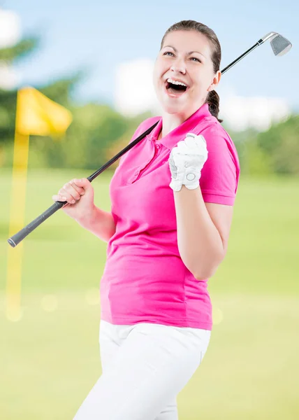 Happy golfer jubilant on a background of golf courses with a gol — Stock Photo, Image