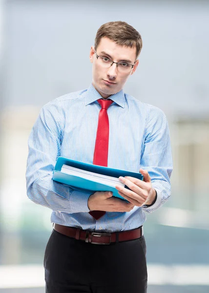 Vertical portrait of chief accountant with folder in the office — Stock Photo, Image