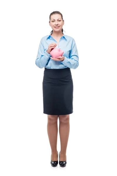 Jonge succesvolle zakenvrouw met een roze spaarvarken op een wit — Stockfoto