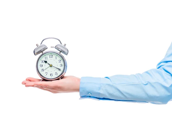 Reloj despertador retro en la mano de una mujer de negocios aislado en un blanco — Foto de Stock