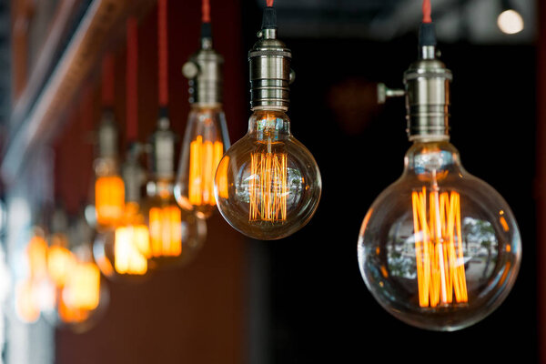 light bulb hanging from the ceiling in a retro style closeup in 