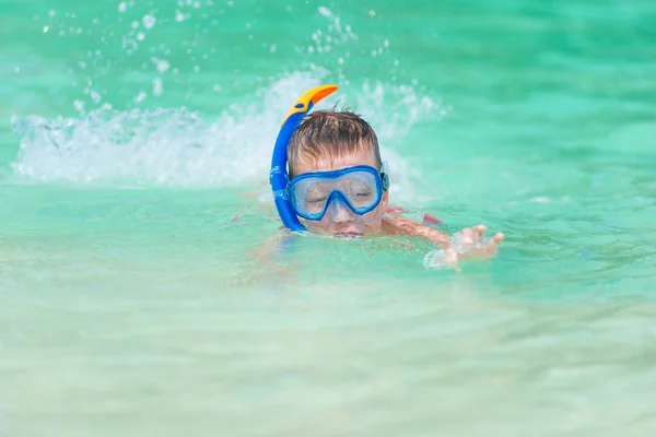 Boy in the sea water in the steamy poppy with snorkel tube — Stock Photo, Image