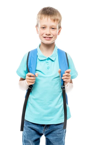 Boy with backpack ready to go to school, portrait on white backg Royalty Free Stock Photos
