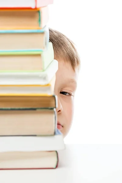 Pile of books to read on the table and peeping out from behind t — Stock Photo, Image