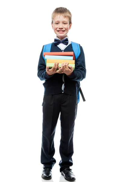 Glimlachend schooljongen poseren tegen witte achtergrond, is portret ik — Stockfoto