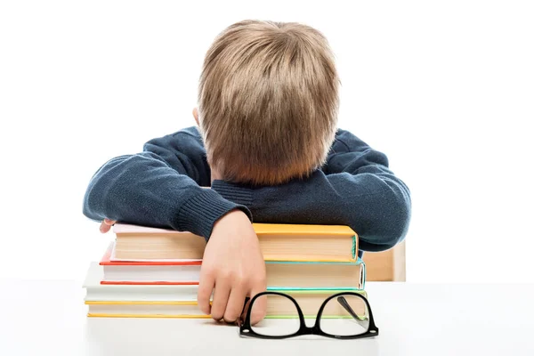 A tired little schoolboy fell asleep on books during a lesson — Stock Photo, Image