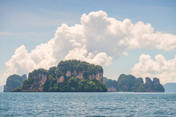 A picturesque view of the mountains and the sea in a foggy haze 