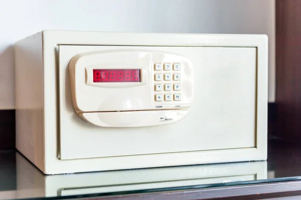 White small safe with coded lock on the table in the hotel close — Stock Photo, Image