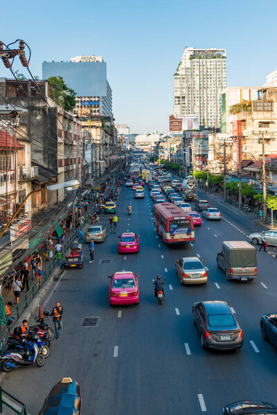 Many cars run on street at Silom district in Bangkok, Thailand. Road-based transport is the primary mode of travel in Bangkok.