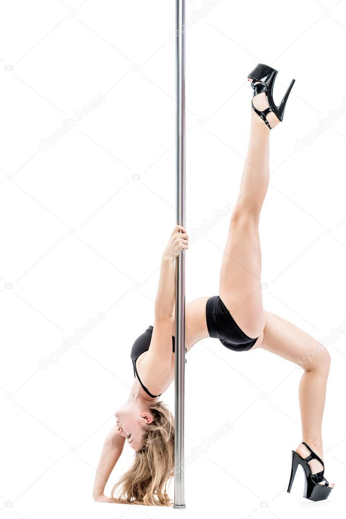 sexy slim athlete with a pylon on a white background