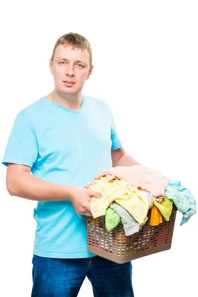 Vertical portrait of a man with a basket of clean linen on a whi — Stock Photo, Image