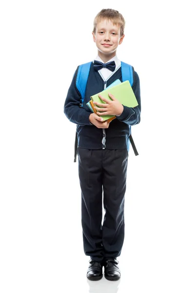 Портрет школяра з книгами на білому тлі в школі — стокове фото