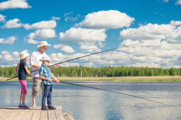 family fishing on weekends on a beautiful lake