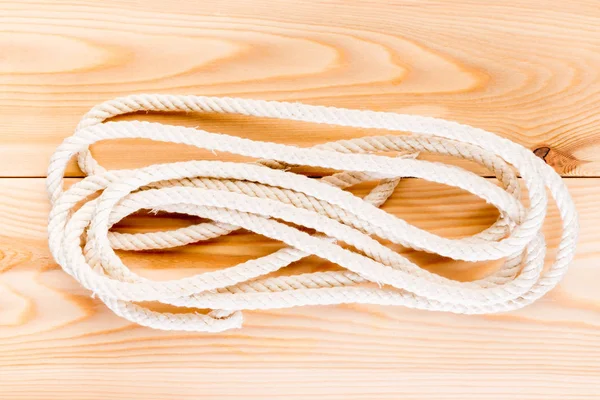 Durable rope on the wooden floor close-up — Stock Photo, Image