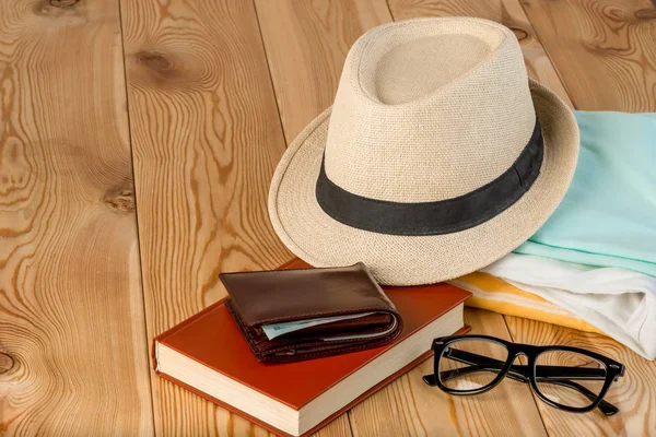 Set of clothes and accessories prepared for travel close-up on a — Stock Photo, Image