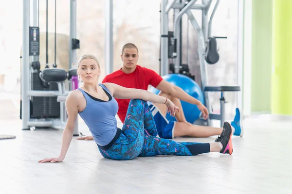 Fitness couple in the gym workout