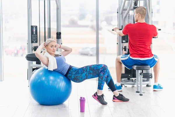 Fitness couple in the gym workout