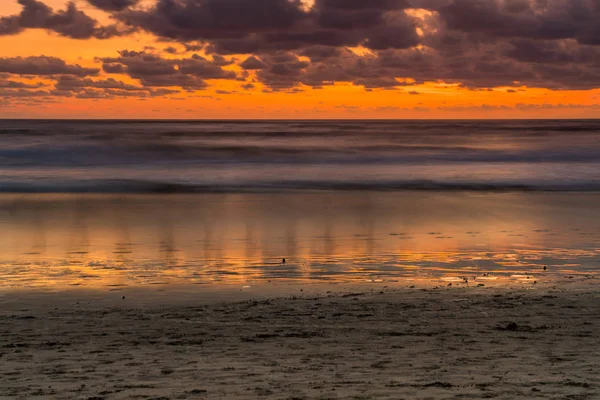 Sunset on the beach — Stock Photo, Image