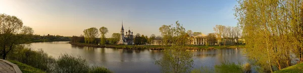 Vologda. Beautiful spring day on the river Bank. Panorama. Churc