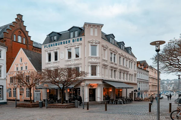 FLENSBURG, GERMANY. JANUARY 28, 2020. Narrow street alley of a small town with old houses and people walking around. — 스톡 사진