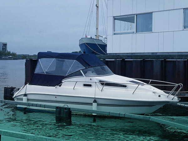 Harbor with sailboats and yachts moored in the port.