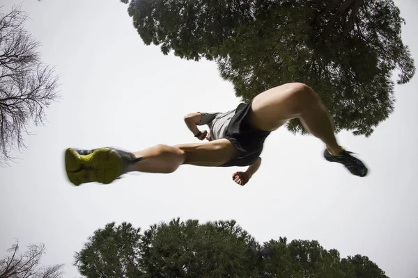 runner jumping bottom view fish eye