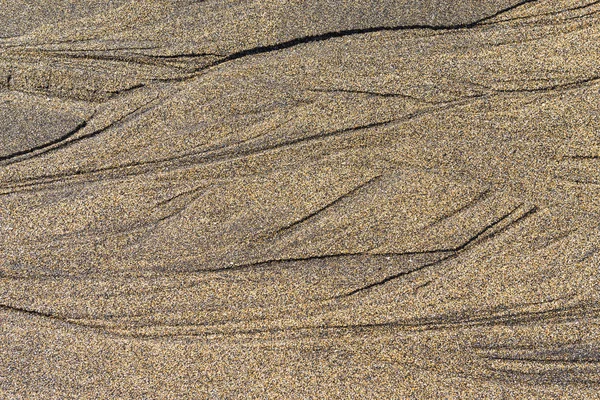 Мокрий пісок візерунком — стокове фото