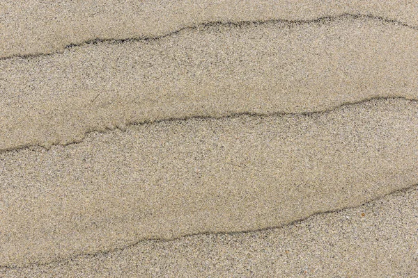 Пісок візерунок з чорними смугами — стокове фото