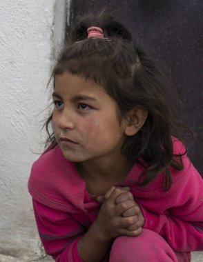 Wakhan, Tajikistan - June 20, 2020: Portrait of a girl in the Wakhan Valley at the Pamir Highway in Tajikistan.