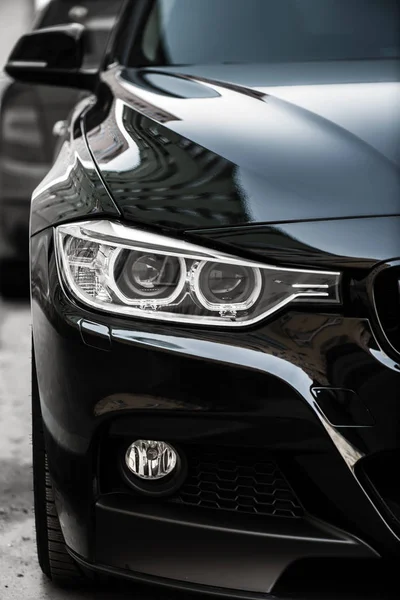 Kyiv, Ukraine - March 4th, 2017: Headlights of Black BMW — Stock Photo, Image