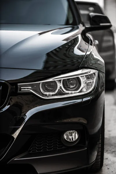 Kyiv, Ukraine - March 4th, 2017: Headlights of Black BMW — Stock Photo, Image