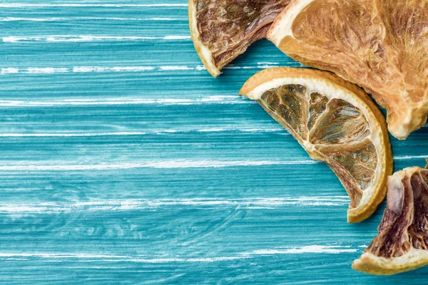 Dried lemon on blue wooden background