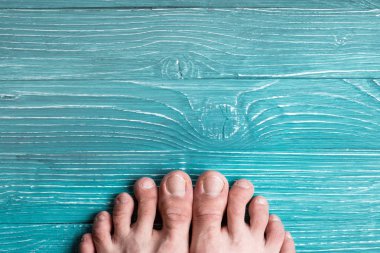 Toes on a background of blue board clipart